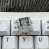 Detail of pointillist engraving on Genshin Impact titanium artisan keycap