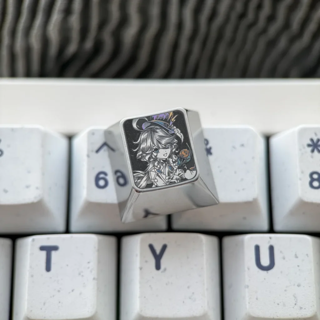 Detail of pointillist engraving on Genshin Impact titanium artisan keycap