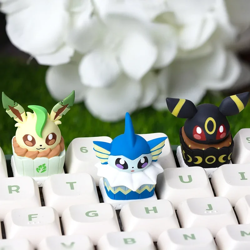 Close-up side view of the Umbreon Cake Artisan Keycap, highlighting the detailed resin sculpting and hand-painted colors.