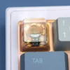 Valorant Brimstone transparent artisan keycap installed on a mechanical keyboard with RGB lighting
