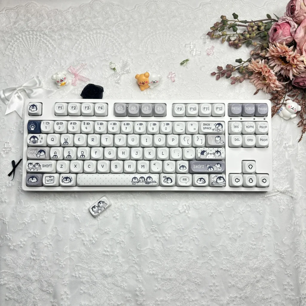 Working Penguin Keycap Set on a white mechanical keyboard, showcasing MOA profile and PBT dye-sub legends