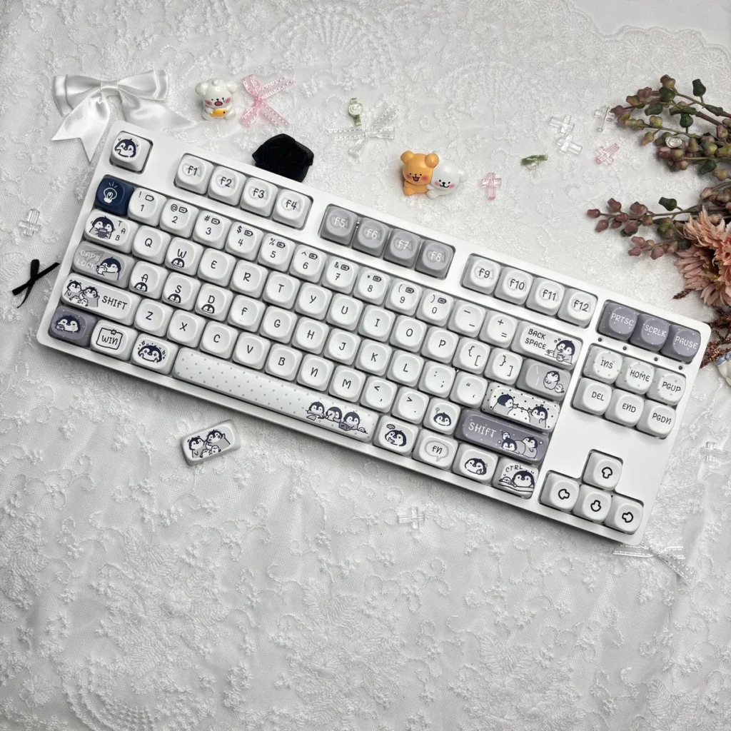 Ergonomic MOA profile keycaps featuring working penguins, demonstrating comfortable typing angle and spherical tops